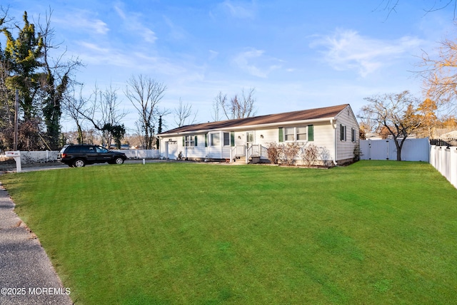 ranch-style house with a front lawn