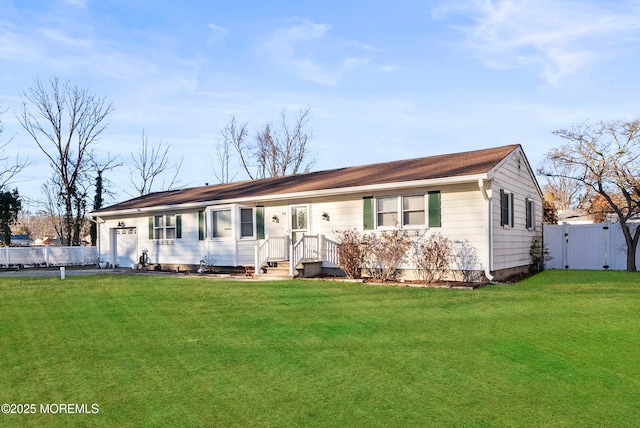 single story home featuring a front lawn