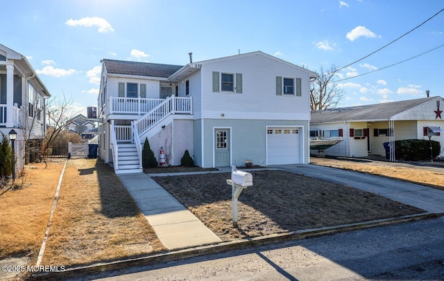 front facade with a garage and a porch