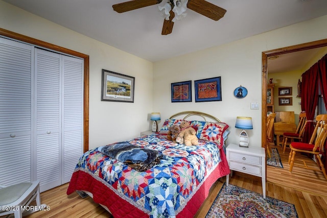 bedroom with ceiling fan, light hardwood / wood-style floors, and a closet