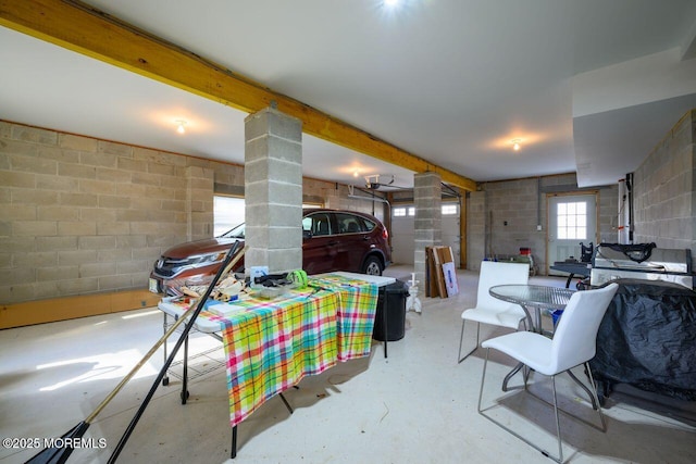 dining area with beam ceiling