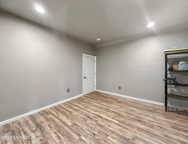 spare room featuring light wood-type flooring