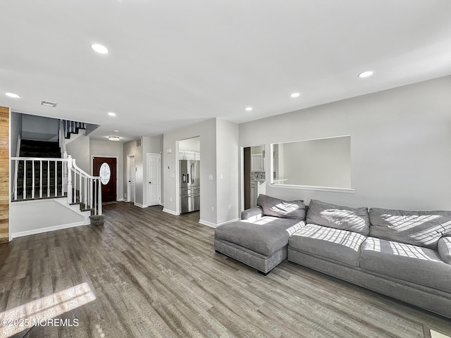 unfurnished living room with hardwood / wood-style floors