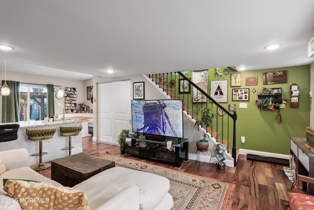 living room with dark hardwood / wood-style flooring