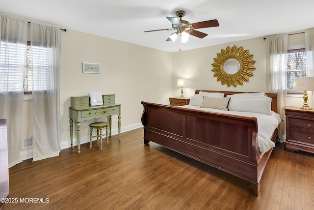 bedroom featuring ceiling fan and dark hardwood / wood-style flooring