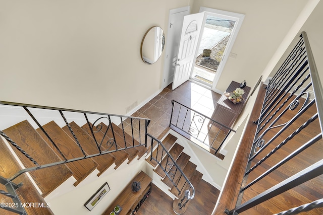 stairs with tile patterned floors