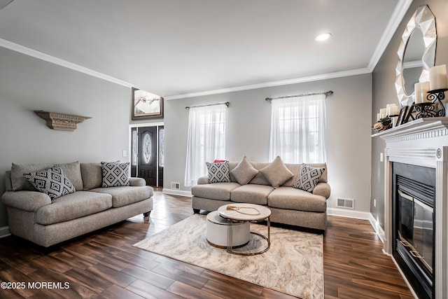 living room featuring dark hardwood / wood-style flooring and crown molding