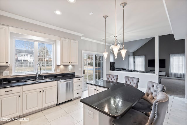 kitchen with sink, a kitchen breakfast bar, dishwasher, a kitchen island, and white cabinets