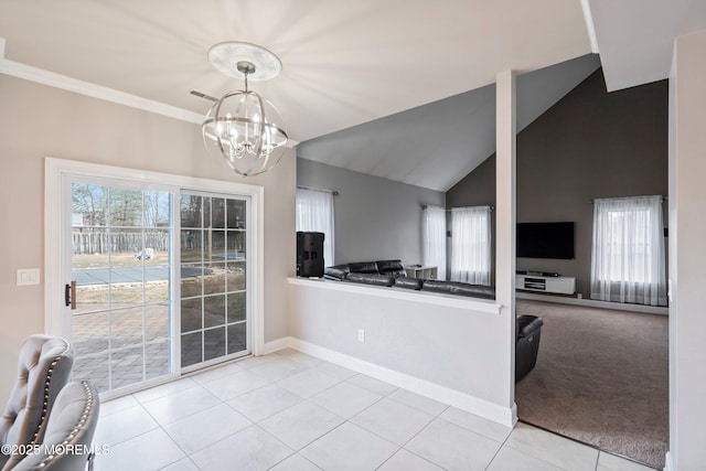 kitchen with crown molding, decorative light fixtures, a chandelier, vaulted ceiling, and light tile patterned floors