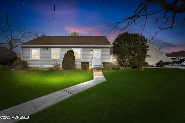 view of front of home with a yard