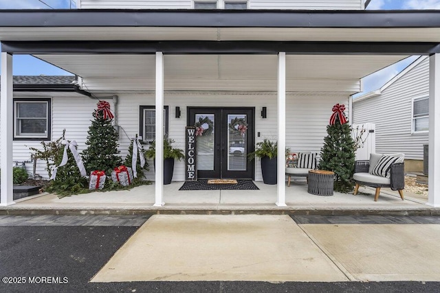 entrance to property featuring french doors and a porch