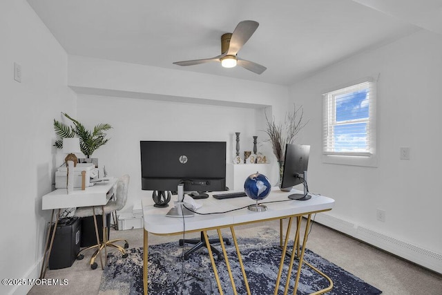 carpeted office space with a baseboard radiator and ceiling fan