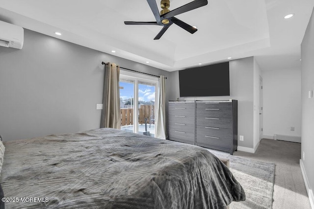 bedroom featuring baseboard heating, a wall mounted AC, access to outside, light colored carpet, and a raised ceiling