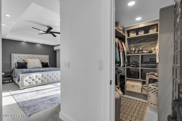 bedroom with a spacious closet and ceiling fan