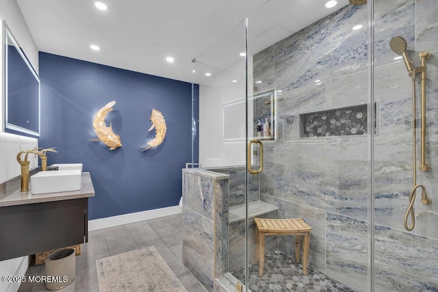 bathroom with vanity, a shower with shower door, and tile patterned floors