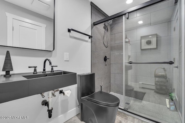 bathroom with an enclosed shower and toilet