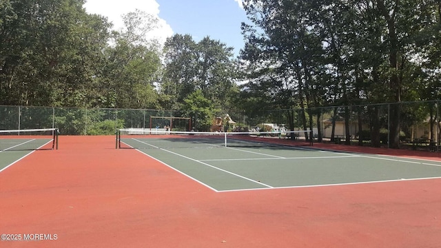 view of sport court with community basketball court and fence