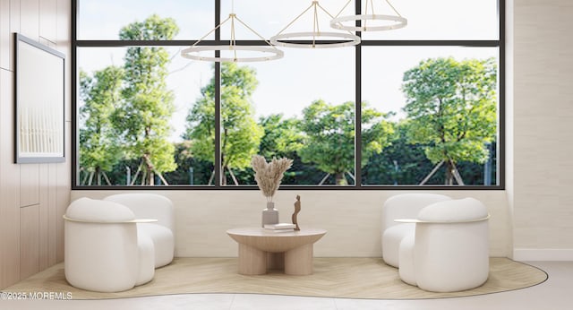 living area with an inviting chandelier