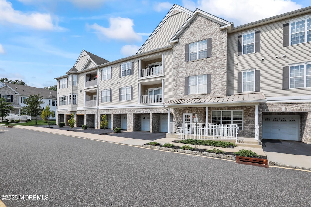 townhome / multi-family property featuring a garage