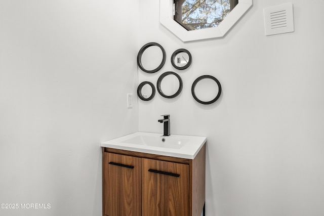 bathroom with vanity and a skylight