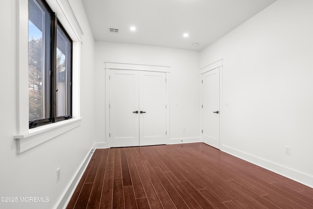 interior space with dark hardwood / wood-style flooring