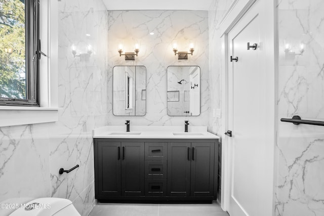 bathroom with vanity and tile walls