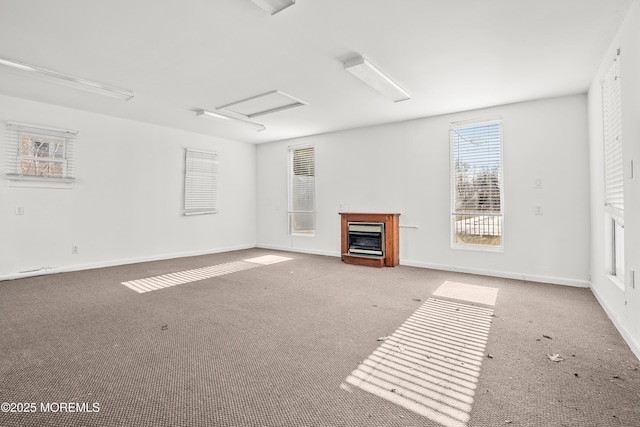 unfurnished living room featuring light colored carpet