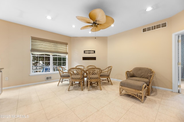 dining space with ceiling fan and light tile patterned floors