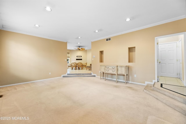 unfurnished living room with light carpet, crown molding, and ceiling fan