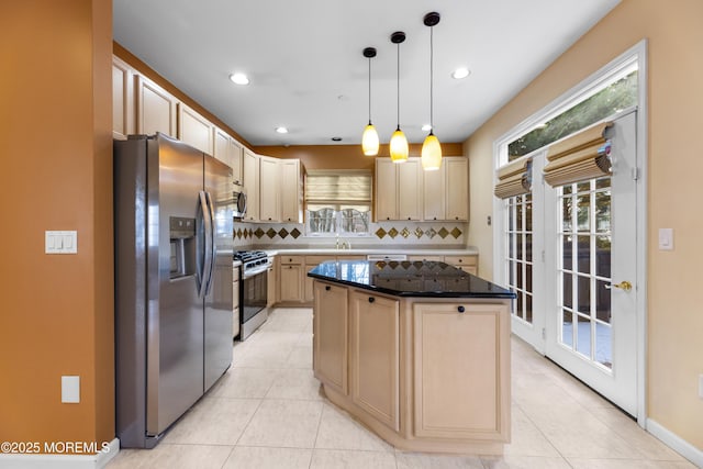 kitchen featuring pendant lighting, stainless steel appliances, a center island, tasteful backsplash, and light brown cabinetry