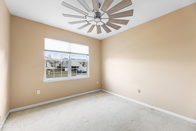 spare room with light carpet and ceiling fan