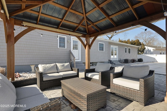 view of patio with a gazebo, outdoor lounge area, and central air condition unit