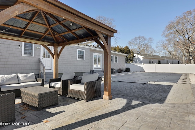 view of patio featuring a gazebo and an outdoor hangout area