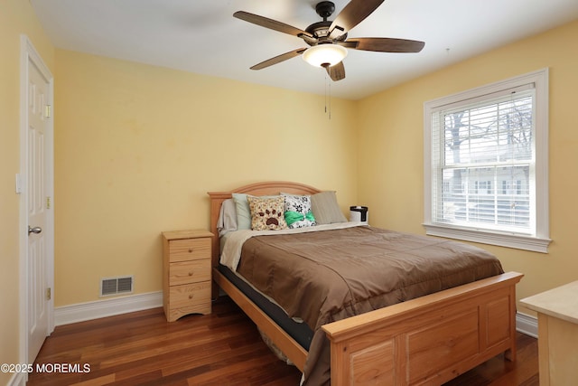 bedroom with dark wood-type flooring and ceiling fan