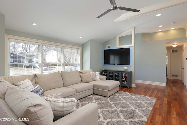 living room with ceiling fan, vaulted ceiling with beams, a wealth of natural light, and dark hardwood / wood-style floors