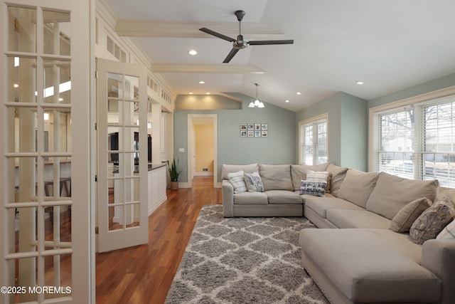 living room featuring dark hardwood / wood-style flooring, lofted ceiling, french doors, and ceiling fan