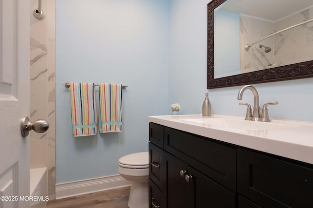 bathroom with vanity, hardwood / wood-style floors, and toilet