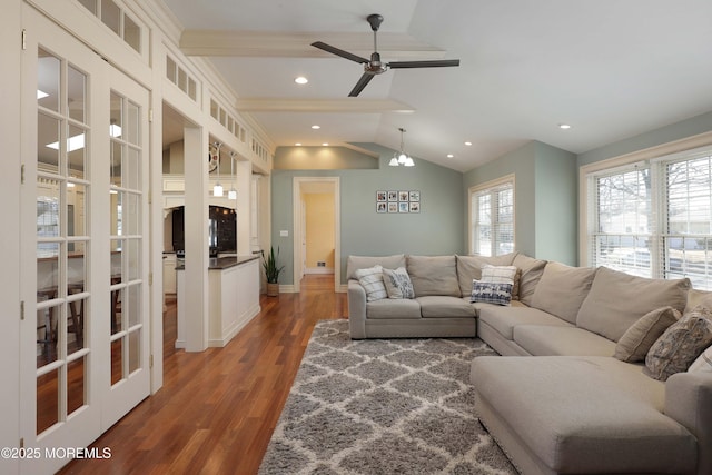 living room with vaulted ceiling, ceiling fan, and dark hardwood / wood-style flooring