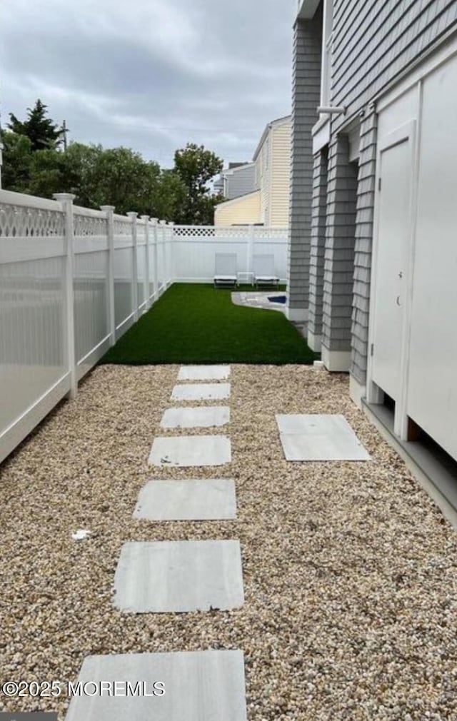 view of yard featuring a fenced backyard