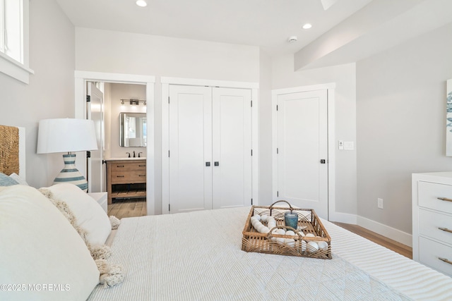 324 3rd St, Beach Haven, NJ 08008 - bedroom with wood finished floors, baseboards, a closet, recessed lighting, and ensuite bathroom