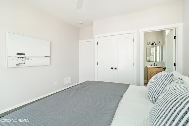324 3rd St, Beach Haven, NJ 08008 - bedroom featuring a sink, a closet, connected bathroom, and baseboards