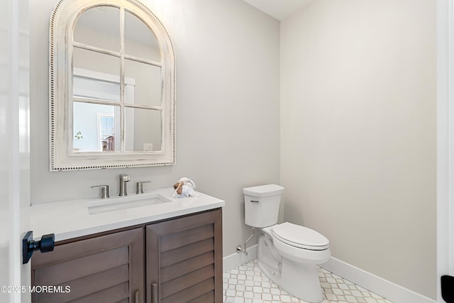 324 3rd St, Beach Haven, NJ 08008 - half bathroom with toilet, baseboards, vanity, and tile patterned flooring
