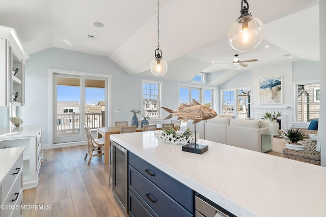 324 3rd St, Beach Haven, NJ 08008 - kitchen featuring vaulted ceiling, wine cooler, plenty of natural light, and hanging light fixtures