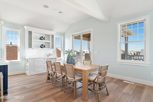 324 3rd St, Beach Haven, NJ 08008 - dining space with vaulted ceiling, plenty of natural light, light wood-type flooring, and baseboards