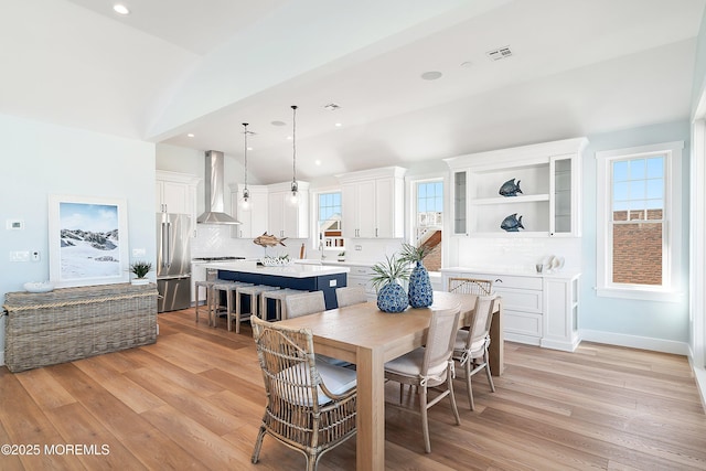 324 3rd St, Beach Haven, NJ 08008 - dining room with light wood-type flooring, vaulted ceiling, and recessed lighting