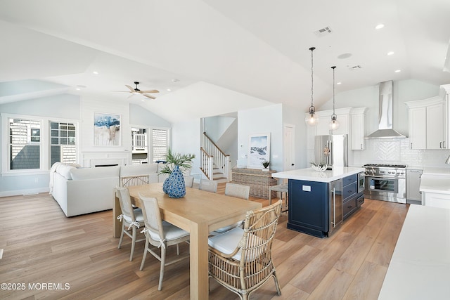 324 3rd St, Beach Haven, NJ 08008 - dining area featuring lofted ceiling, light wood-style flooring, stairway, a ceiling fan, and recessed lighting