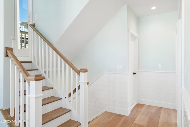 324 3rd St, Beach Haven, NJ 08008 - staircase with a wainscoted wall, wood finished floors, and recessed lighting