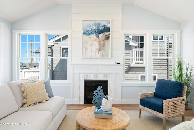 324 3rd St, Beach Haven, NJ 08008 - living area featuring vaulted ceiling, wood finished floors, a fireplace, and baseboards