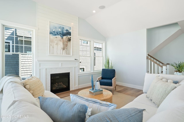 324 3rd St, Beach Haven, NJ 08008 - living area with wood finished floors, lofted ceiling, baseboards, a tiled fireplace, and stairs