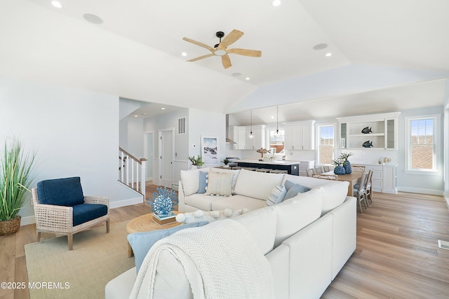 324 3rd St, Beach Haven, NJ 08008 - living area featuring lofted ceiling, stairway, a ceiling fan, light wood-style flooring, and baseboards
